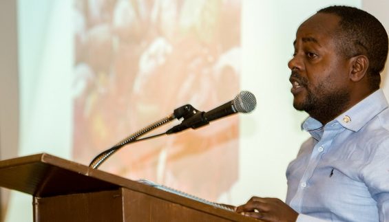 Amani Matabaro Tom speaking at the LA Jews for Refugees Assembly. Photo by Shlomit Levy Bard/HIAS